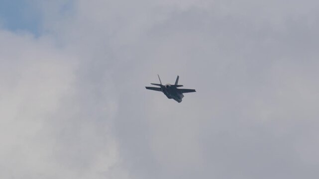 F-35 Lightning II flying in formation during military training exercise above the clouds