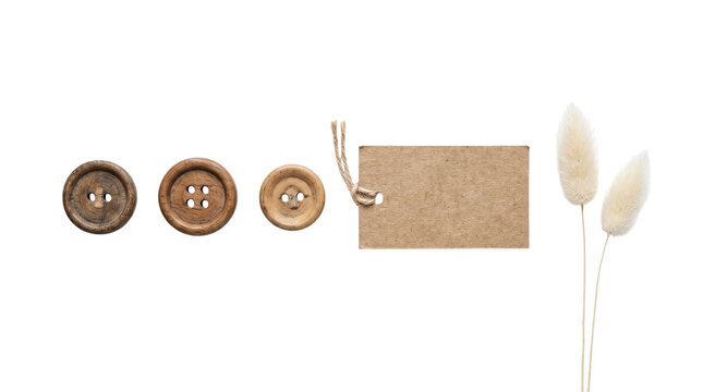 Flat lay of wooden buttons blank kraft paper tag and lagurus grass on a transparent background