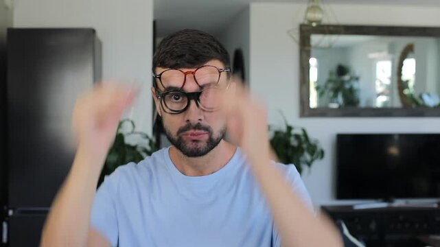 Man with severe vision problems wearing four different types of eyeglasses simultaneously