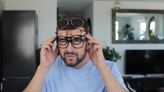 Man with severe vision problems wearing four different types of eyeglasses simultaneously