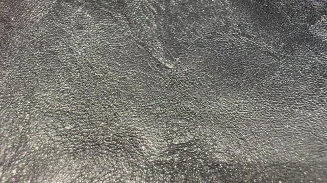 Macro Close Up of Shimmering Leather Texture Background. Close Up Glitter Leather Texture Background with Shimmering Surface
Macro view of glitter leather texture with a subtle shimmering surface. 