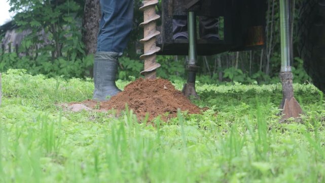 engineering geological surveys, environmental soil analysis, a drill drills into the soil