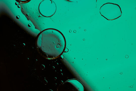 Abstract oil and water bubbles background with neon color gradient