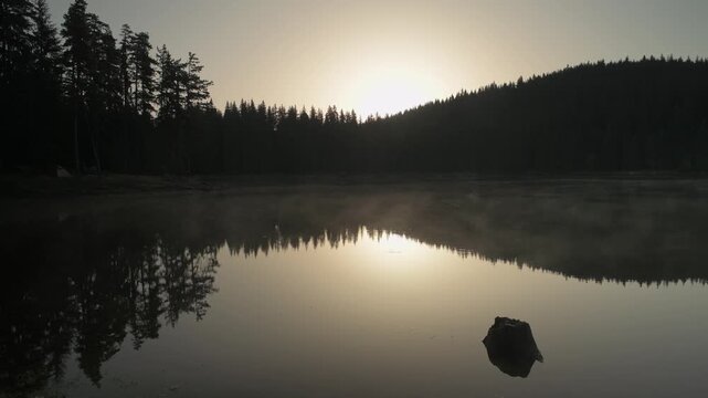 Sunrise over Shiroka polyana dam (Wide meadow), Rodopi mountain, Bulgaria.
