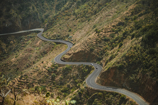 Winding mountain road through rugged landscape