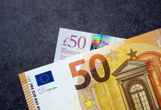 Fifty euros and fifty British pounds close-up. National currencies of Europe