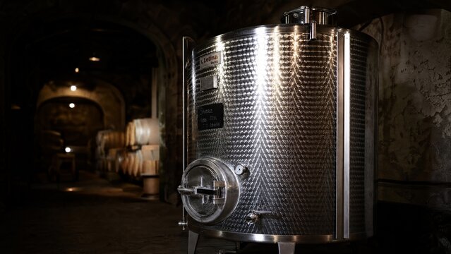 fermenter. Large stainless steel fermenter in a dimly lit wine cellar. bar promotions, beverage menus, designed for food & beverage menus and cafe branding, elevates brand perception.
