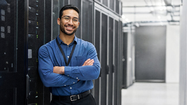 Smiling IT Engineer Standing in Modern Server Room