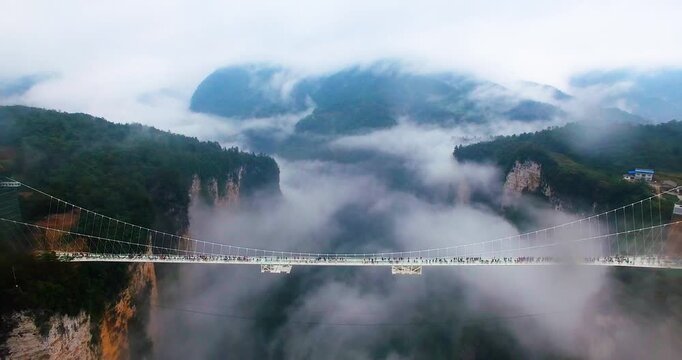 Zhangjiajie Grand Canyon Glass Bridge Above Foggy Mountain Canyon in China in Zhangjiajie Grand Canyon, Hunan, China