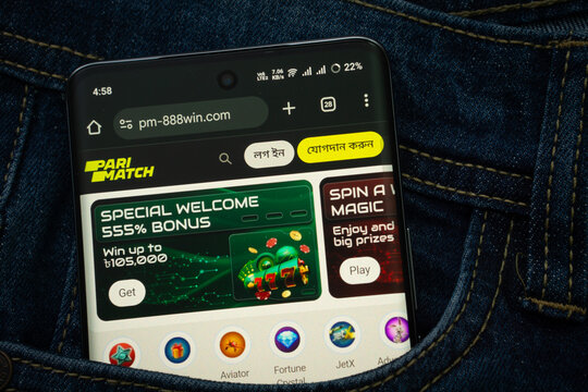 Dhaka, Bangladesh- 15 June 2025: A smartphone displaying the Parimatch web interface peeks out of a denim pocket.