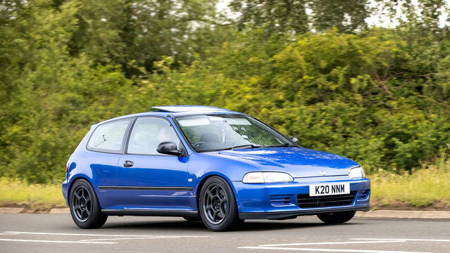 Stony Stratford,Bucks,UK - June 7th 2026: 1995 blue Honda Civic classic car driving on a British road