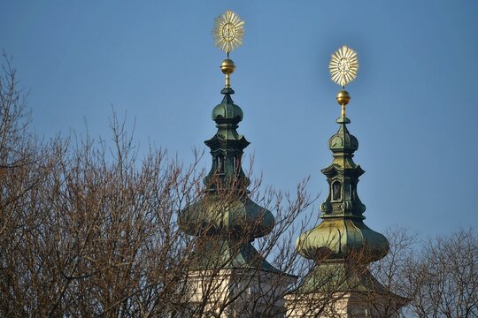 Gothic style bell tower architectural detail of Mariahilferkirche, a 13th century Baroque style pilgrimage church in Graz, Austria.