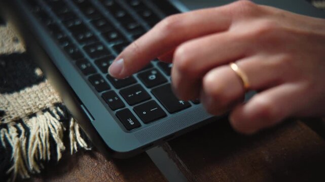 4K close-up video of an anonymous woman's hands pressing the Esc key on a laptop after encountering website errors. Technology, troubleshooting and computer workflow concept.
