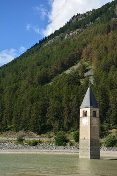 Old bell tower of the sunken church of Graun / Curon,  in lake Reschen / Resia, South Tirol, Italy
