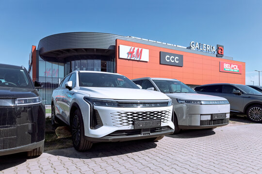 Poznan, Poland - April 2, 2026. Brand new Omoda and Jaecoo cars displayed at a dealership.