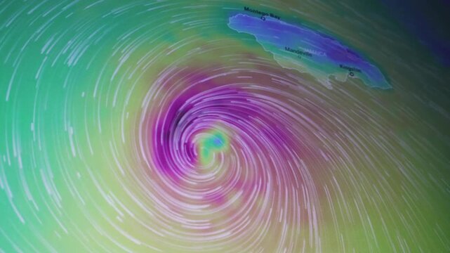 Dynamic hurricane anomaly near Jamaica shown as a camera shot of a computer screen with pixels visible featuring tropical cyclone wind flow climate data and severe weather visualization for news scien