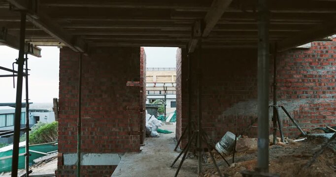 Construction, brick wall or empty building at site, work in progress or steel for engineering. Architecture development, project and incomplete infrastructure, support structure and framework