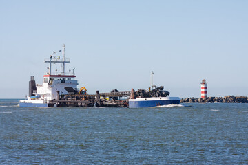 Obraz premium Dredger Entering Harbor in IJmuiden, Netherlands