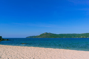 Fototapeta premium White sand on a sunny day at Logbon Island. Romblon, Philippines