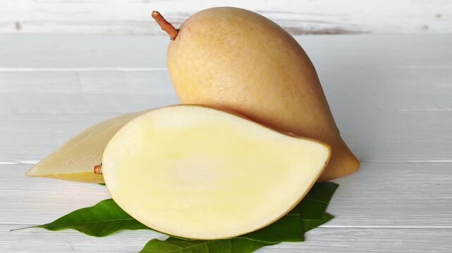 Ripe yellow mango species name Nam Dok Mai. A popular mango native to Thailand.
