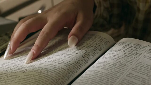 conservative Woman Reading the Bible at table with bread food and drink indoors