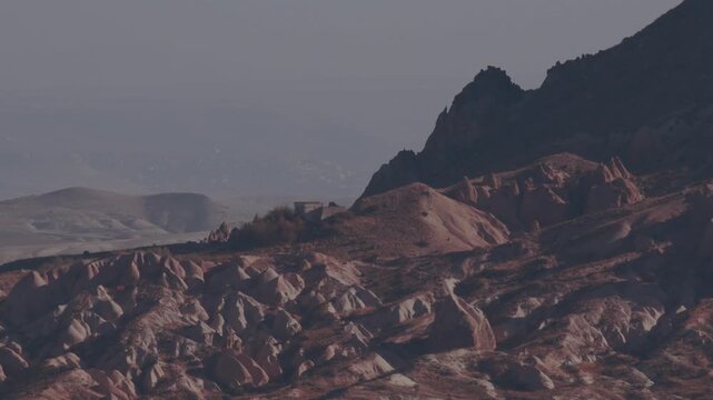 Explore Cappadocias unique rock formations and ancient landscape in Turkey