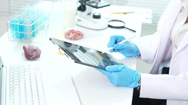 Food safety scientist testing meat, eggs, and biological samples in a laboratory, conducting contamination screening, microbiological analysis, and quality control procedures.