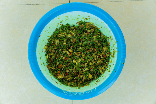 a Balinese traditional food called lawar featuring finely chopped long beans tossed with aromatic spices and seasoned grated coconut. Only available during Galungan and Kuningan's Day.