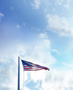 American Flag at flagpole over dramatic sky