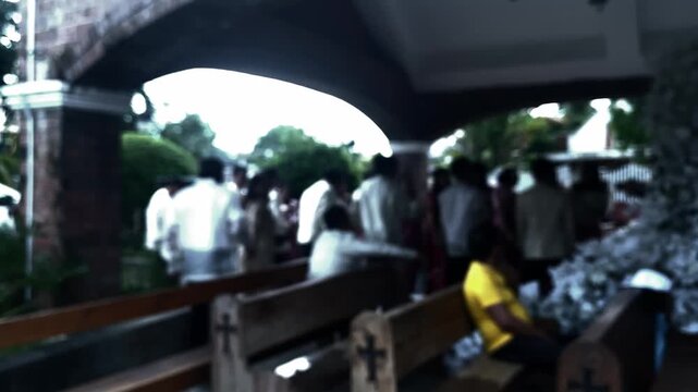 Wedding photoshoot at the aisle of the chapel featuring the newlywed couple along with their entourage. Blurs