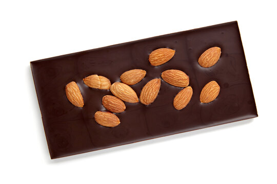 Dark chocolate with whole almonds isolated on white background top view.