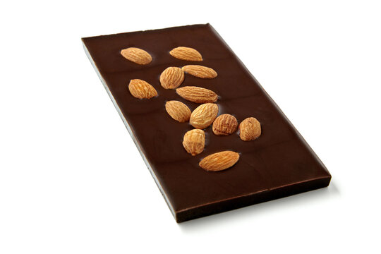 Dark chocolate with whole almonds isolated on white background.