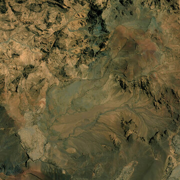 High resolution satellite map - Aerial view featuring mountains covered in lush green forests blending into flatter