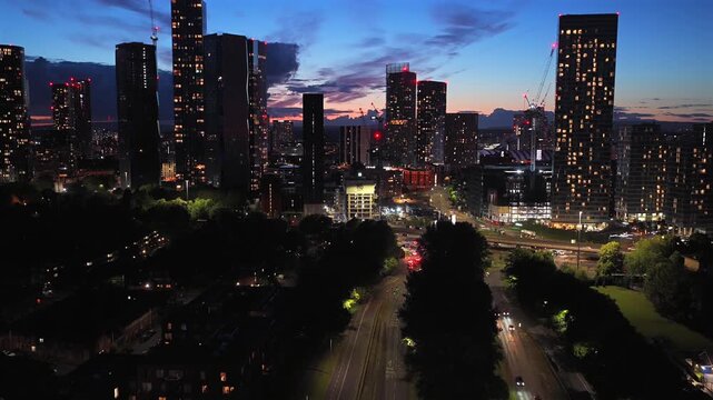 Aerial Night Video of Manchester Skyline and Mancunian Way Traffic. 