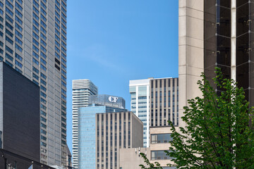 Naklejka premium View of a CF Cadillac Fairview sign mounted on the top of an office building surrounded by high-rise towers in downtown Toronto, highlighting commercial real estate and urban architecture, May 2026