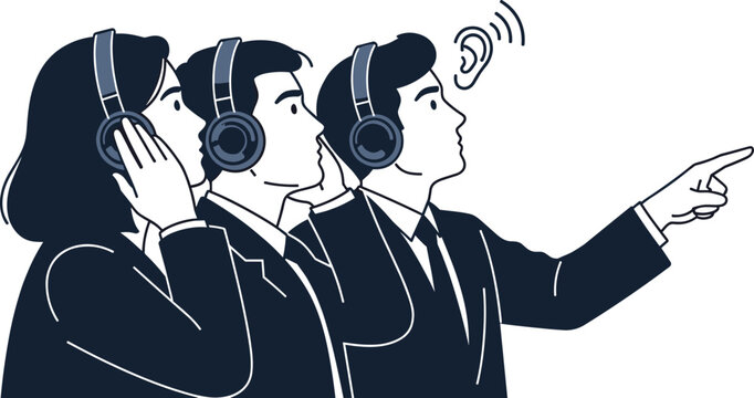 Group of business professionals wearing headphones and listening closely while pointing toward a corporate tech presentation