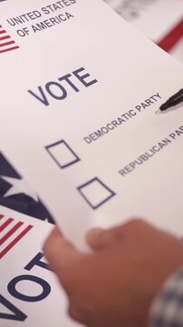 A U.S. citizen holding a ballot at a polling station during the U.S. Congressional midterm elections