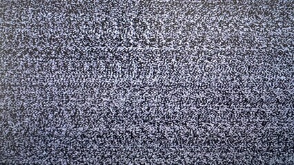 Fototapeta premium Close-up of static tv screen with black and white noise