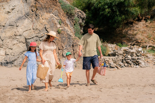 Family coming to a beach 