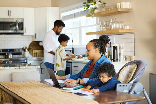 Family Working and Cooking Together in a Home Kitchen