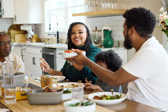 Family Enjoys Lunch Together in a Home Kitchen