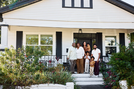 Family Poses on Porch in Afternoon Light