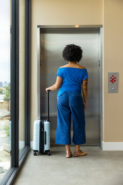 Black Girl waiting for elevator
