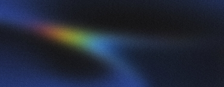 A narrow band of yellow, green, and blue light spectrum forms an abstract diagonal streak on a dark, grainy background, suggesting clarity and focus.