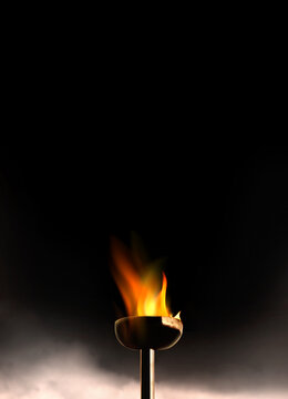 Close up burning flaming torch over black background