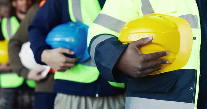 Hands, row and people with hard hat for construction, safety and ppe briefing for inspection. Team, preparation and helmet in workplace for protocol, protection and site compliance for architecture