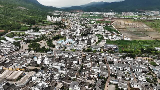 Aerial View of Rural Town, Farmland and Mountains