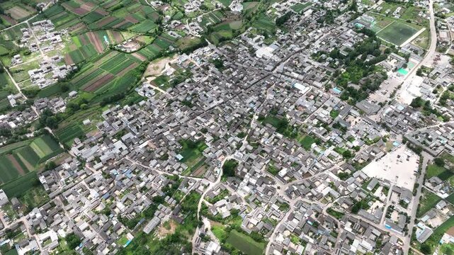 Aerial view of rural village surrounded by farmland