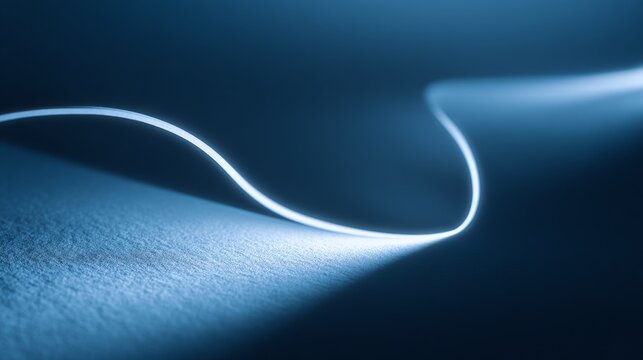 Soft glowing line curves across textured blue surface. Minimalist design evokes calm, futuristic, or technological moods. Ideal for digital interfaces, abstract backgrounds, or creative projects