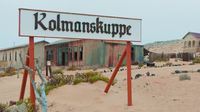 Abandoned ghost town Kolmanskop welcome sign in Namibia